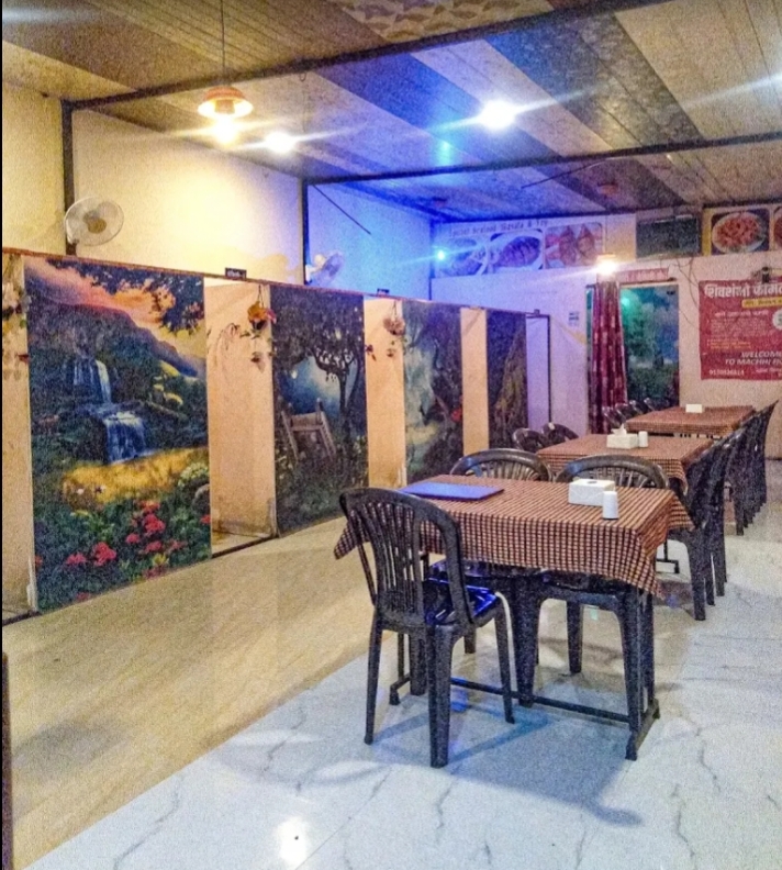 Dining room with scenic partition artwork